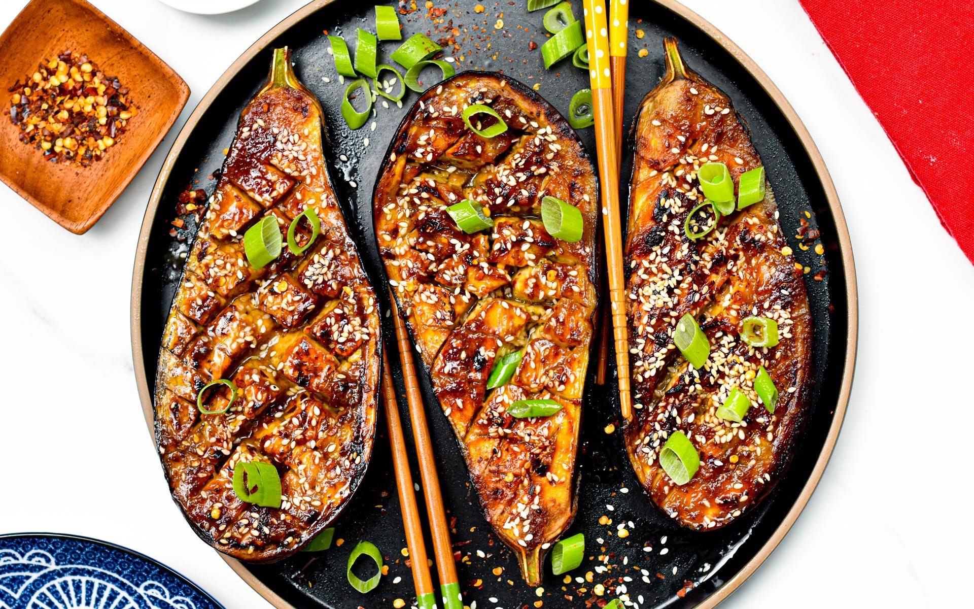 These delicious Miso Glazed Eggplant melt-in-your mouth with the most delicious sweet and savory miso glaze. Bonus, this delicious Asian-style recipe is also vegan and gluten-free.