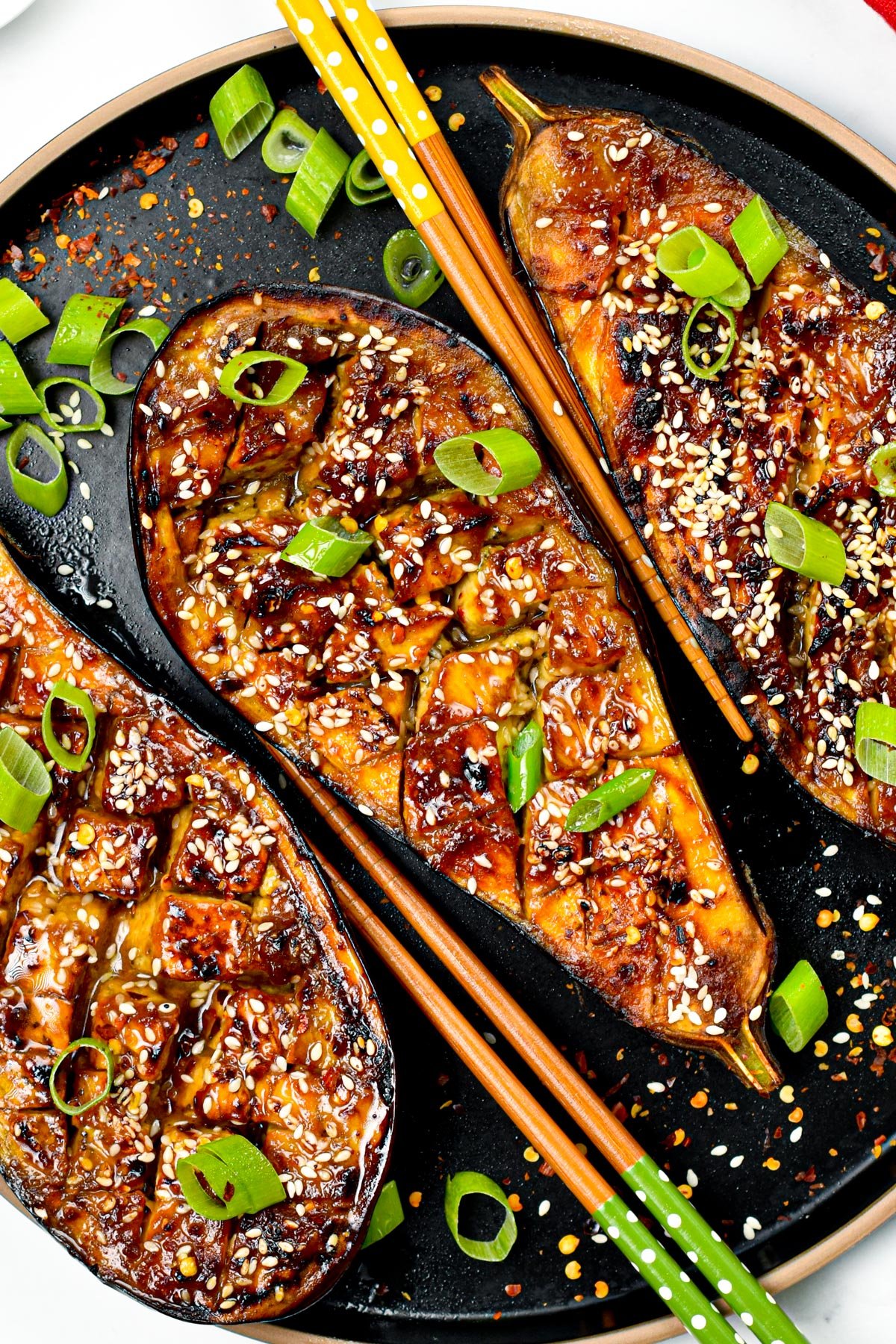 These delicious Miso Glazed Eggplant melt-in-your mouth with the most delicious sweet and savory miso glaze. Bonus, this delicious Asian-style recipe is also vegan and gluten-free.