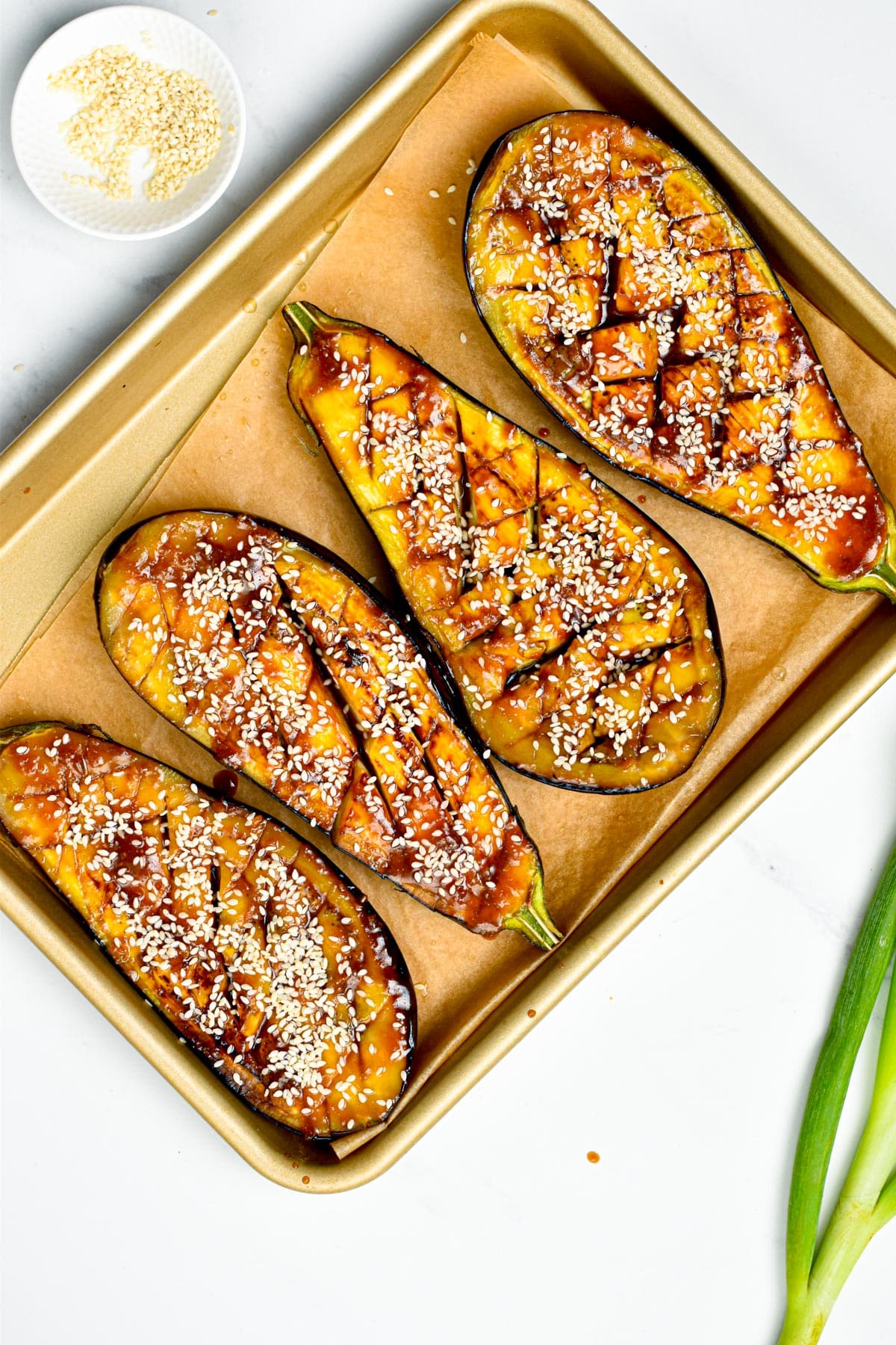 These delicious Miso Glazed Eggplant melt-in-your mouth with the most delicious sweet and savory miso glaze. Bonus, this delicious Asian-style recipe is also vegan and gluten-free.