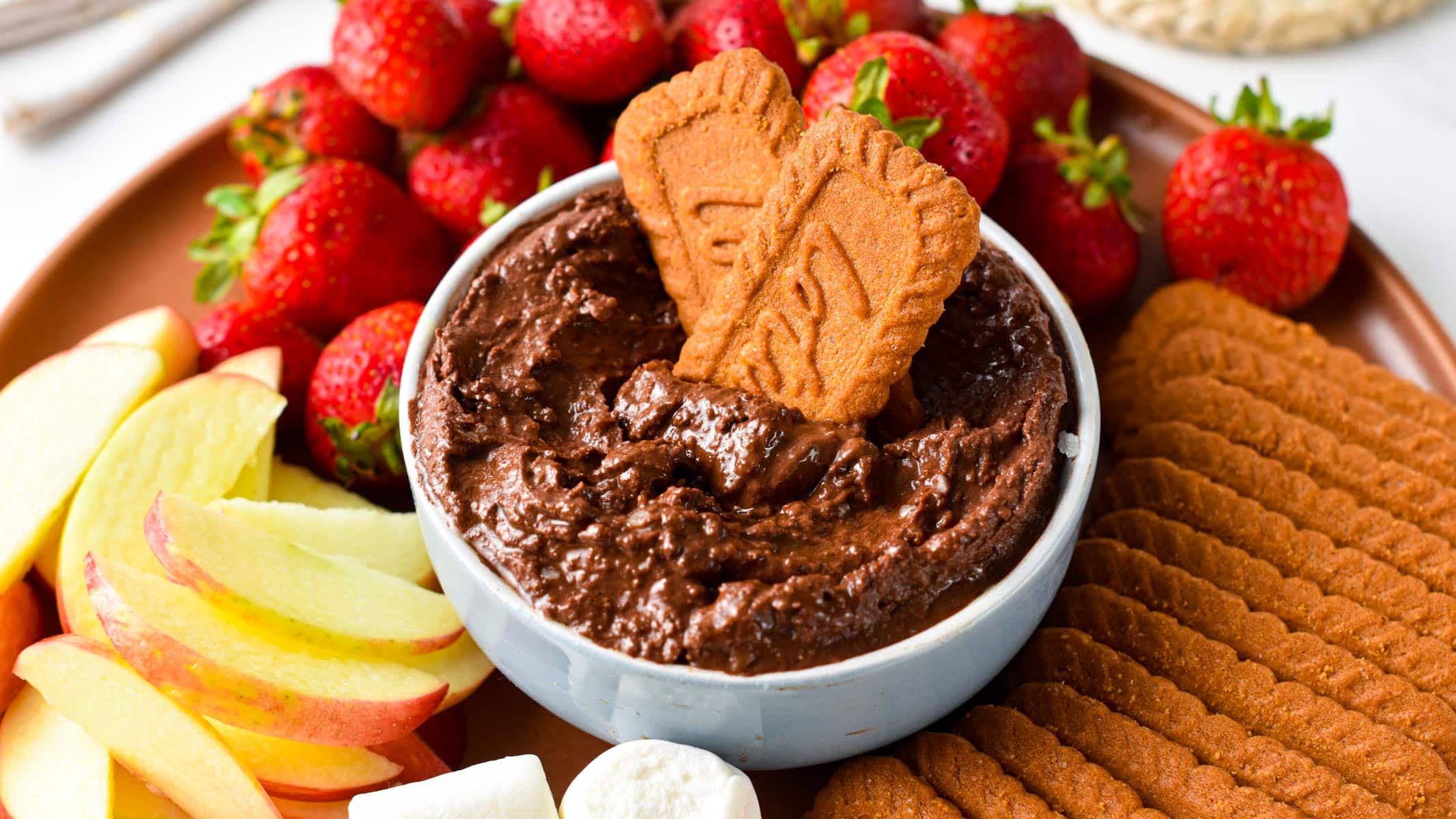 Dipping biscuits into Dark Chocolate Hummus.