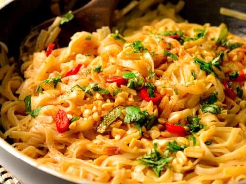 These Peanut Noodles are creamy, thai-inspired rice noodles cooked in a creamy sweet peanut sauce. If you are a fan of quick and easy noodle recipes, this one is a must-try.