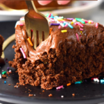This Protein Cake recipe is a high-protein moist chocolate birthday cake perfect as a healthy celebration cake. It's packed with 15 grams of protein per serving and topped with the best creamy smooth chocolate protein frosting.