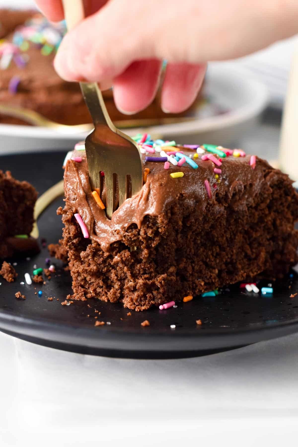 Fork digging into a slice of Protein Cake.