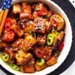 This Szechuan Tofu will fix your spicy Chinese food craving! Delicious crispy tofu pieces coated with a spicy Sichuan sauce packed with garlic, chili pepper, and Schezuan pepper.