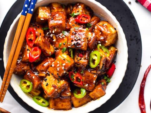 This Szechuan Tofu will fix your spicy Chinese food craving! Delicious crispy tofu pieces coated with a spicy Sichuan sauce packed with garlic, chili pepper, and Schezuan pepper.