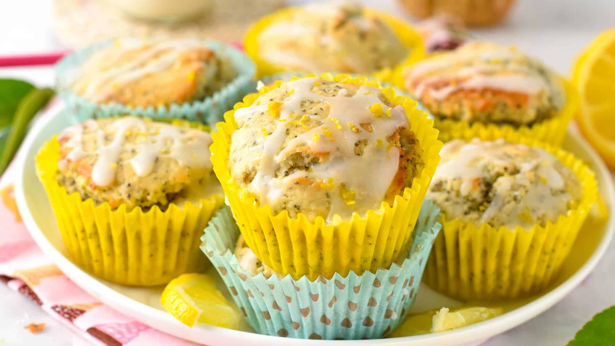 These Vegan Lemon Poppyseed Muffins are light fluffy breakfast muffins with bursting lemon flavors with a sweet tangy lemon glaze.