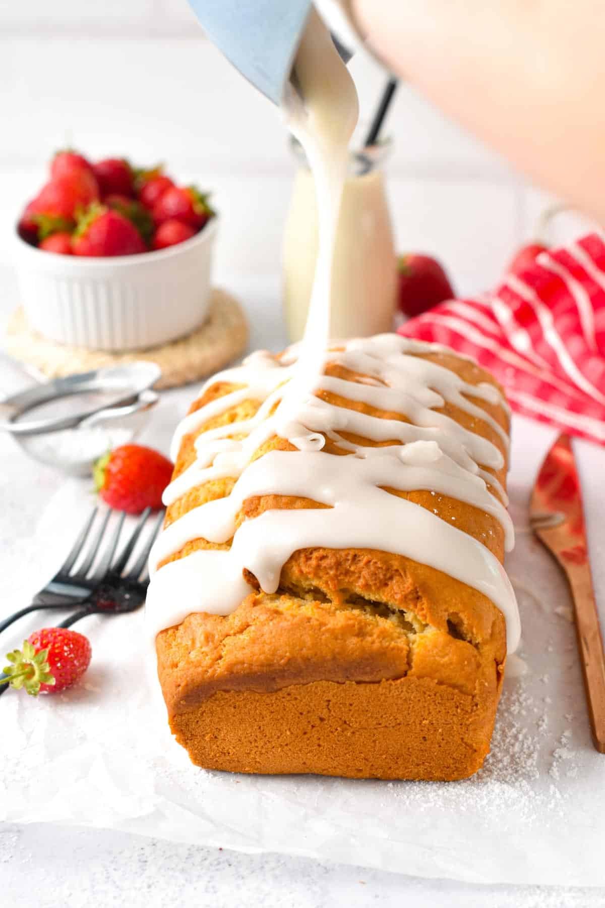 Pouring icing on top of the Vegan Pound Cake.