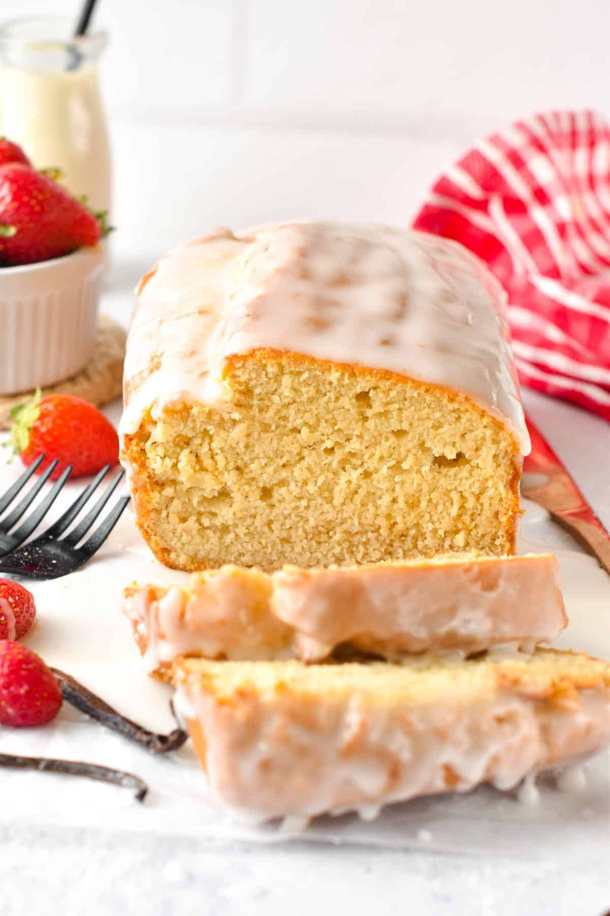 Vegan Pound Cake on a breakfast table with the first slices down.