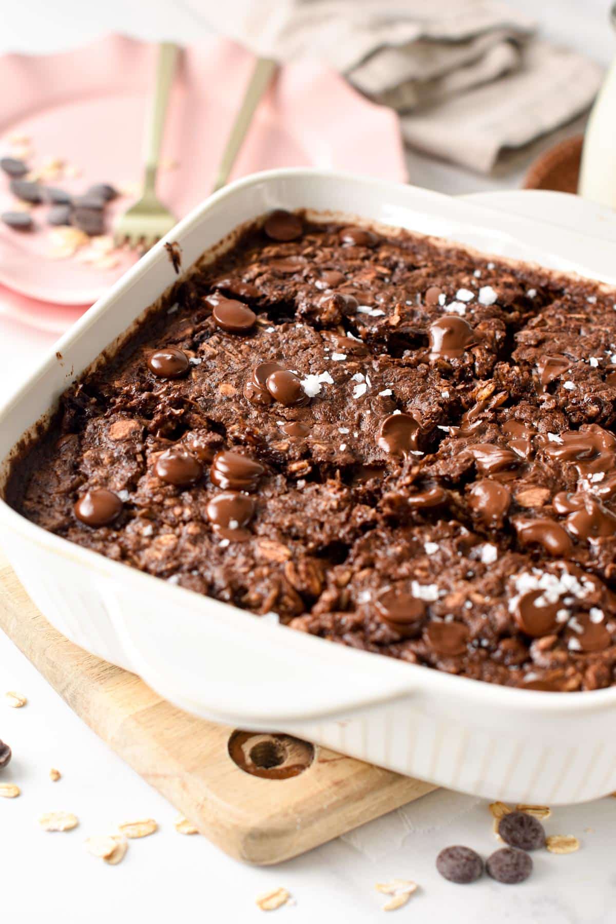 Brownie Baked Oatmeal sliced in its ceramic baking dish.