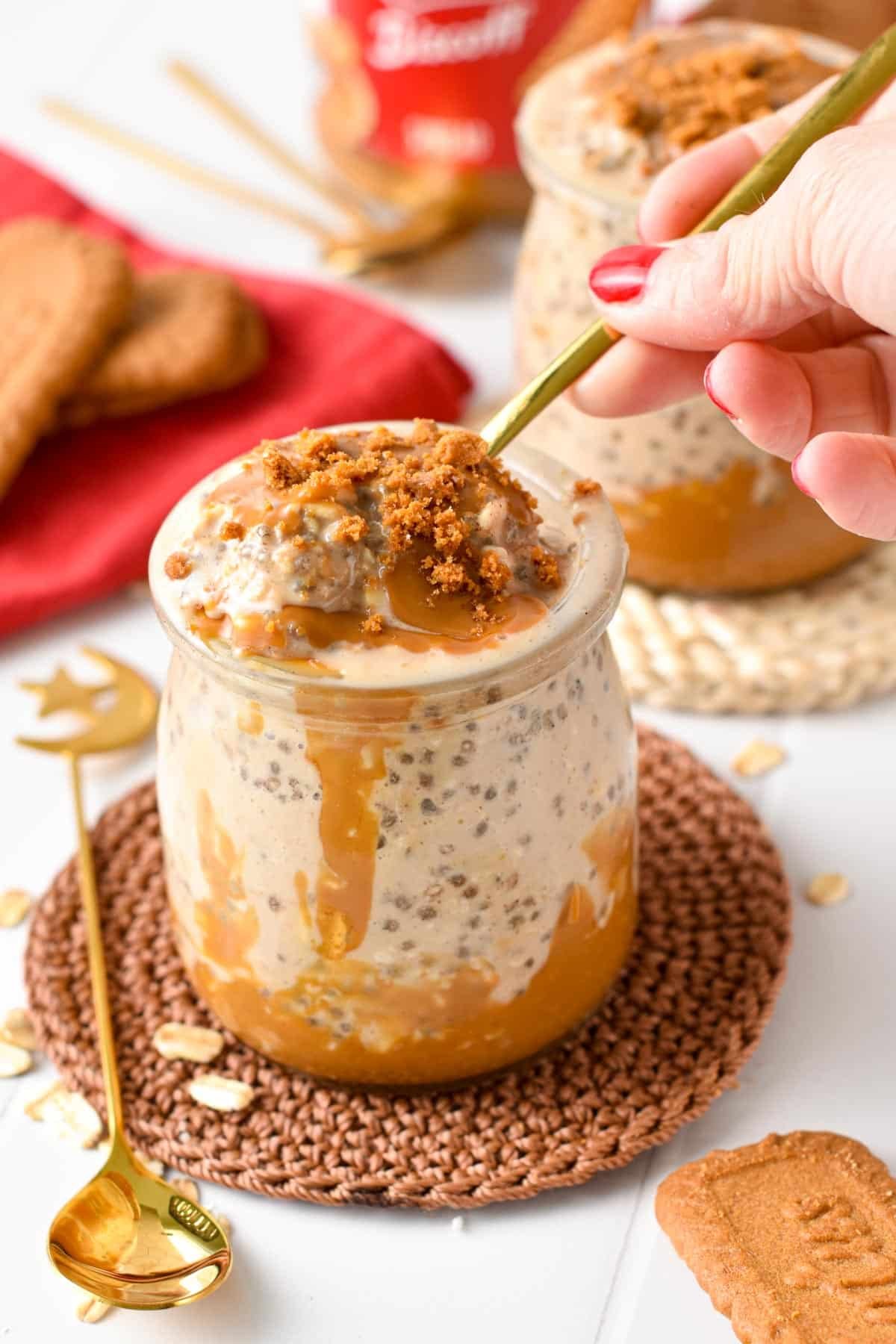 Golden spoon digging into Biscoff Overnight Oats