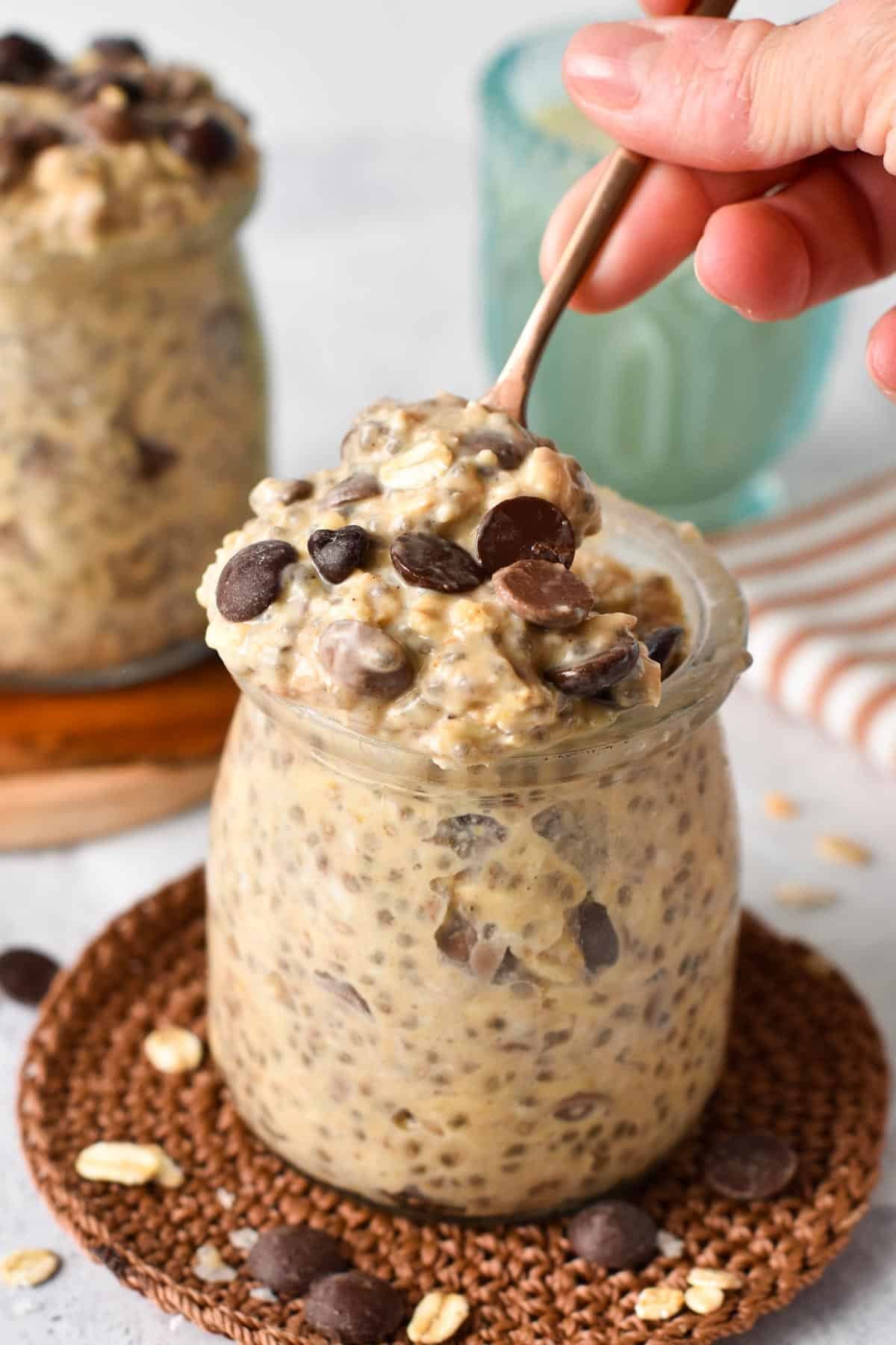 Cookie Dough Overnight Oats in a jar with a spoon.