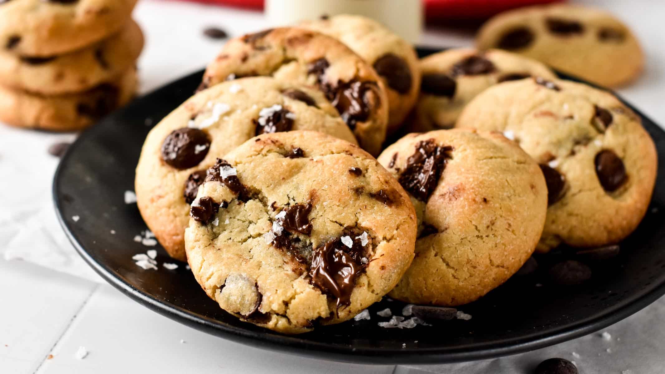 Eggless Chocolate chip cookies on a black plate.