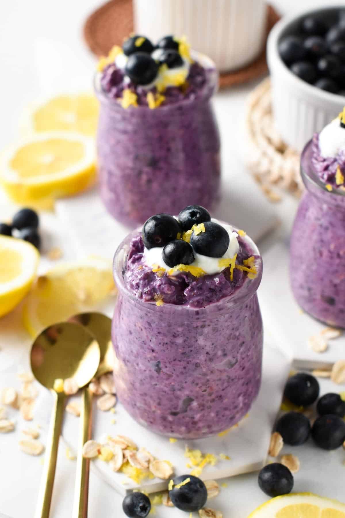 Blueberry Overnight Oats in three mason jars.