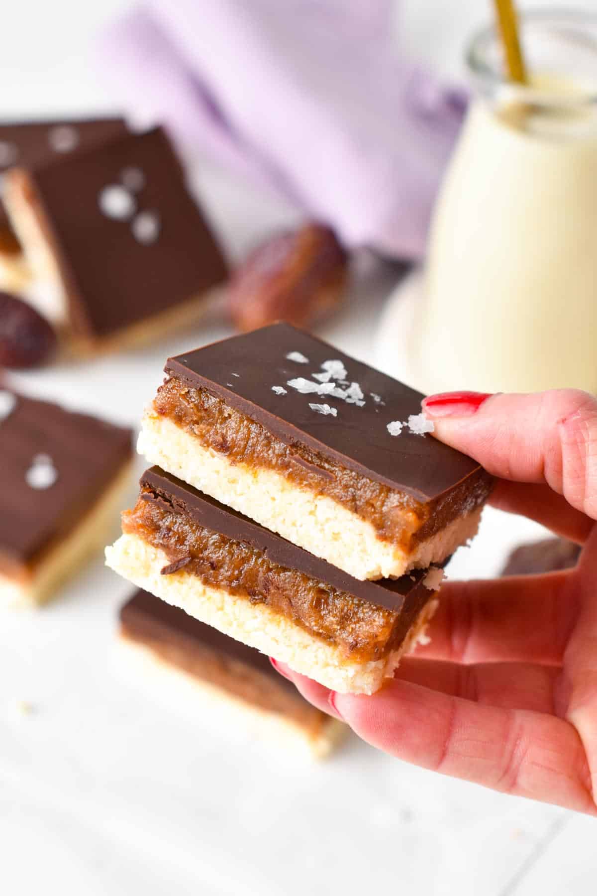 This healthy caramel slice is a delicious no-bake dessert made from an almond coconut base and topped with a date peanut butter caramel. If you love healthier treats naturally sweetened with wholesome ingredients, this is the best caramel slice you will ever make.