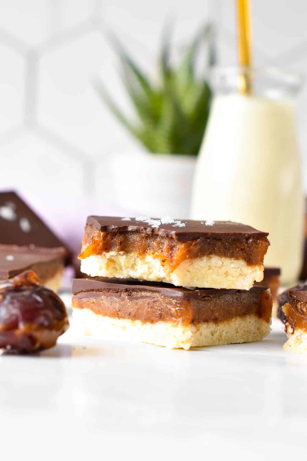 Healthy caramel slice stacked on a table.