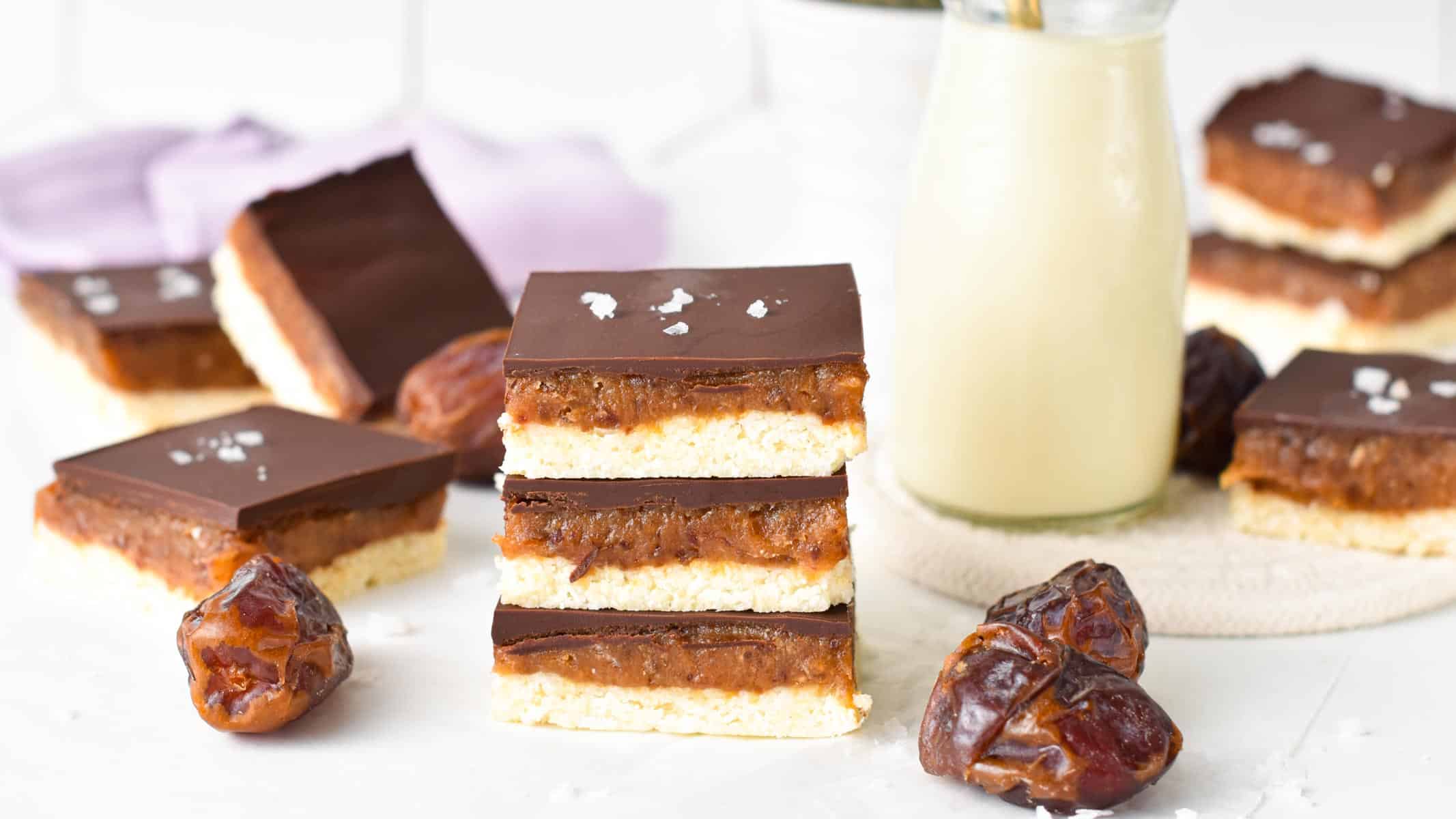 This healthy caramel slice is a delicious no-bake dessert made from an almond coconut base and topped with a date peanut butter caramel. If you love healthier treats naturally sweetened with wholesome ingredients, this is the best caramel slice you will ever make.