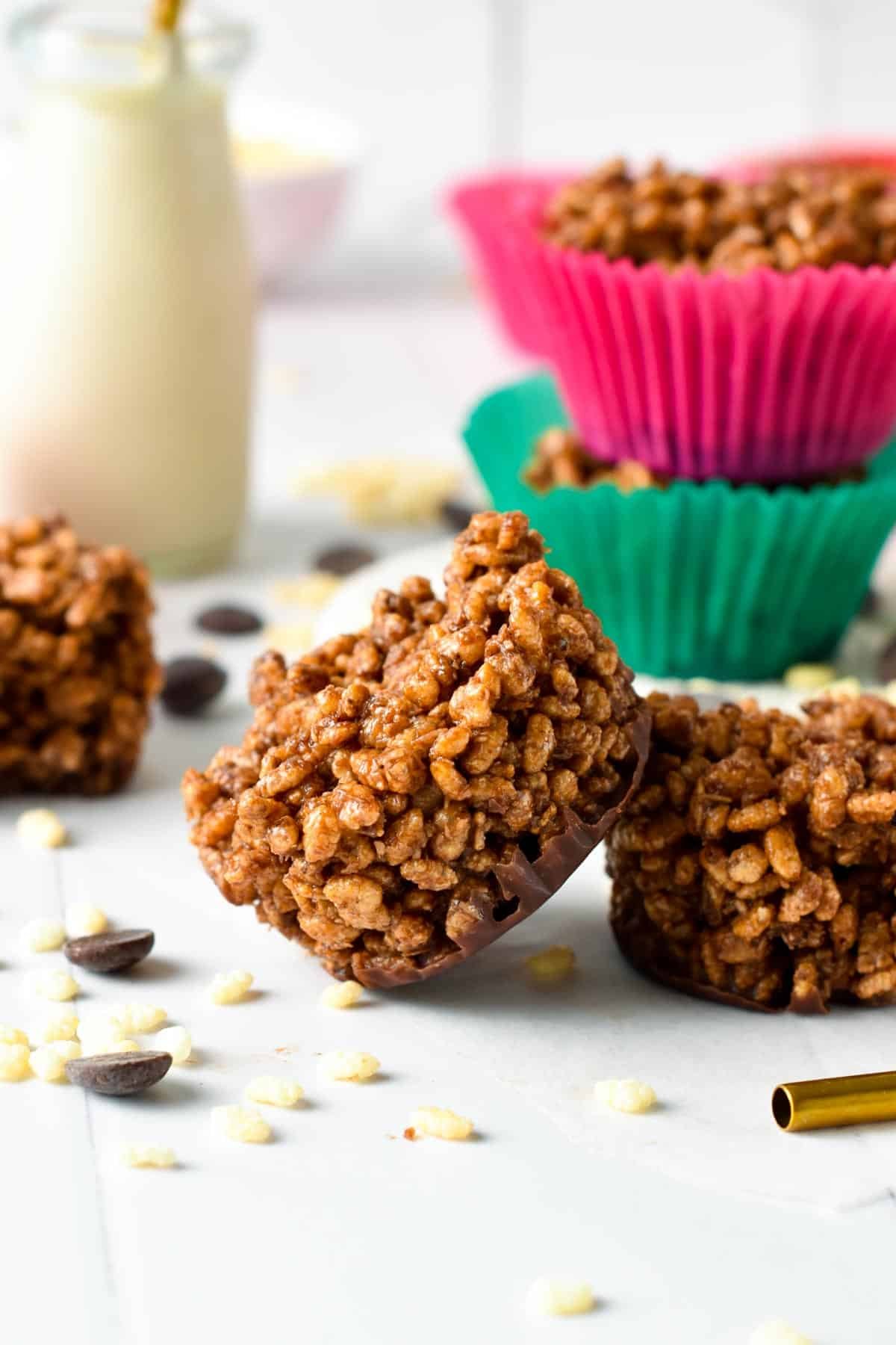 Healthy chocolate crackles stacked on a table.