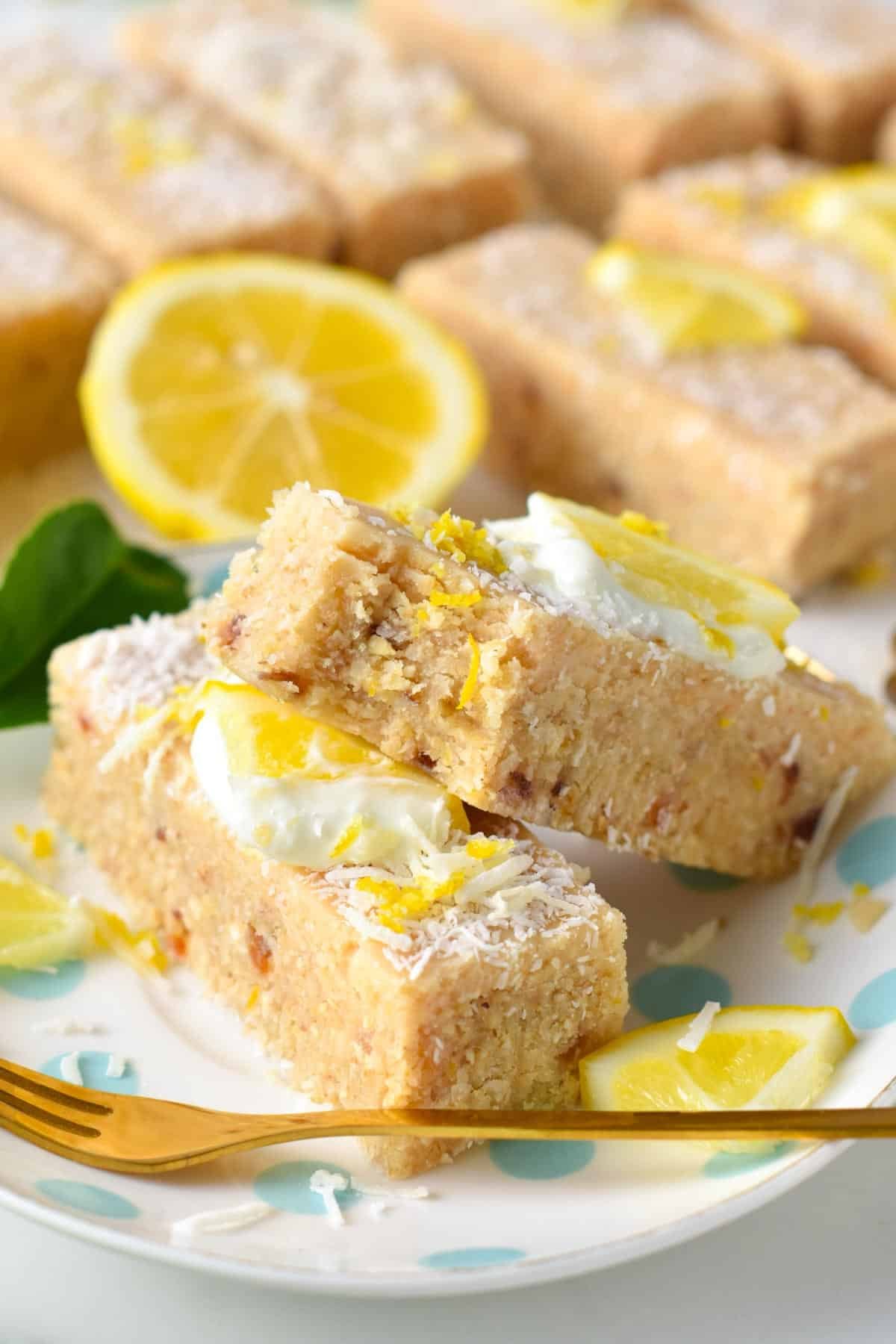 Healthy lemon slice stacked on a small plate with a lemon in the background.