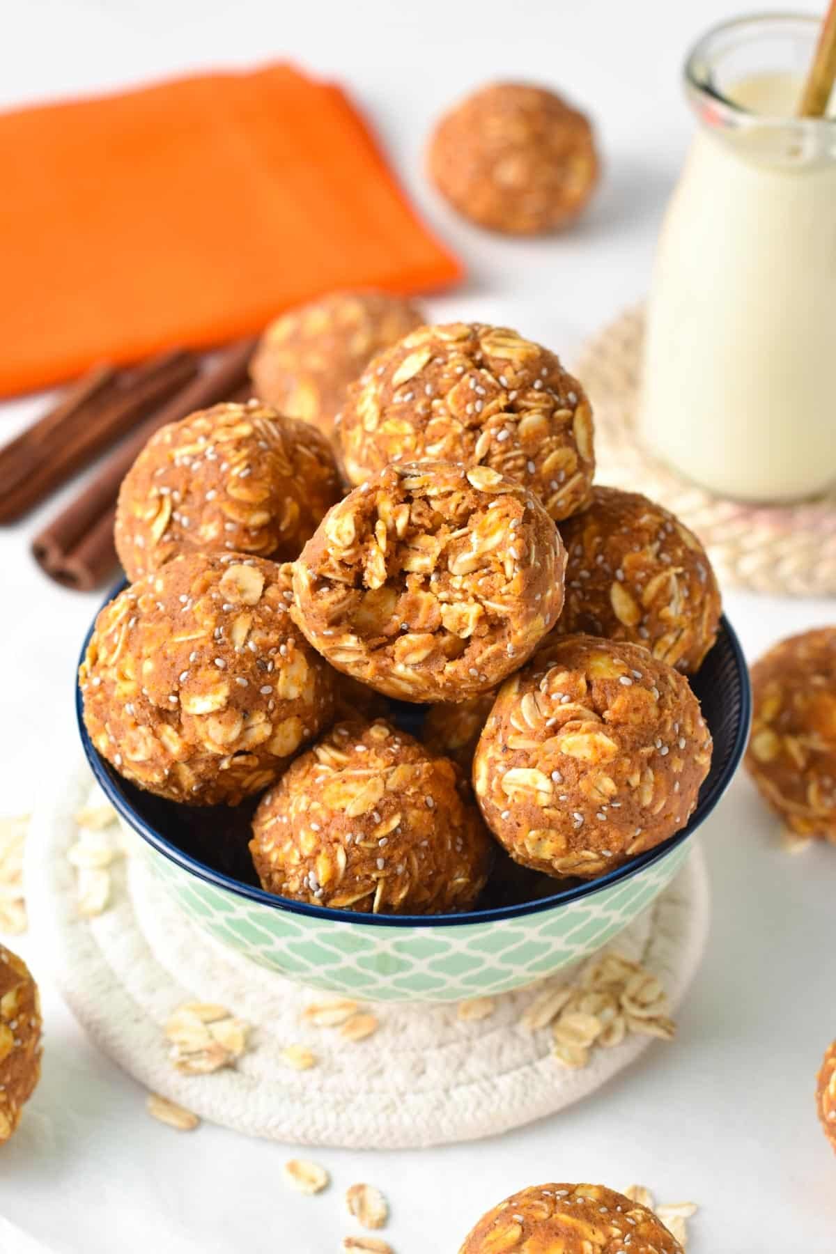 Pumpkin Protein Balls stacked in a small bowl.