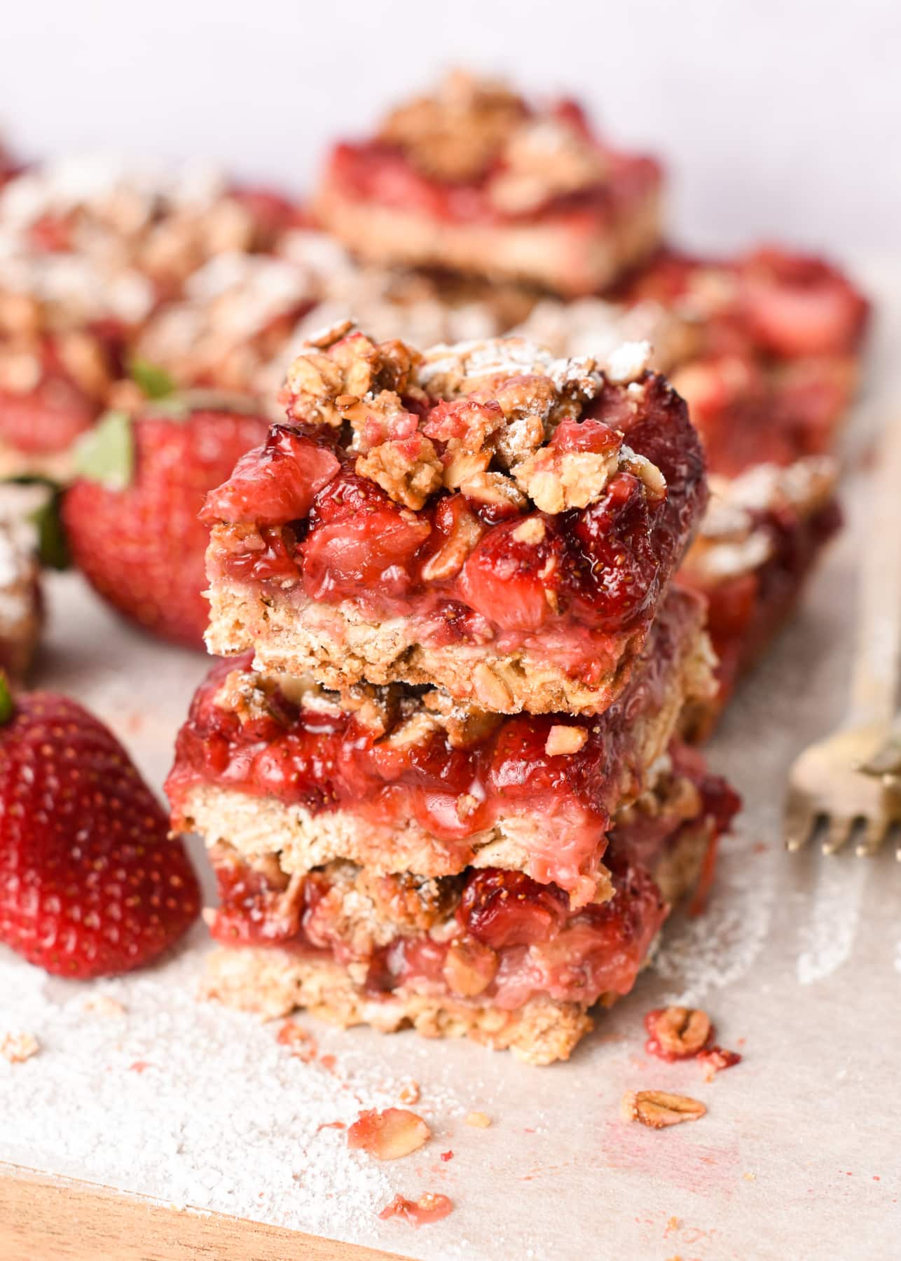 Strawberry Oatmeal Bars stacked on a table.