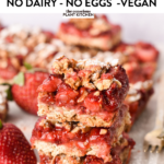 These Strawberry Slices are healthy strawberry breakfast bars made with a crispy oat layer topped with cooked strawberry jam and oat crumble.