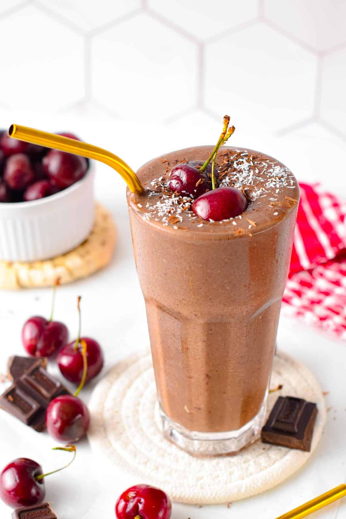 This Chocolate Cherry Smoothie is a thick and creamy chocolate smoothie packed with cherries. It has the most delicious chocolate cherry flavors, like a black forest dessert but in healthy drinks packed with spinach and chia seeds to energize you.