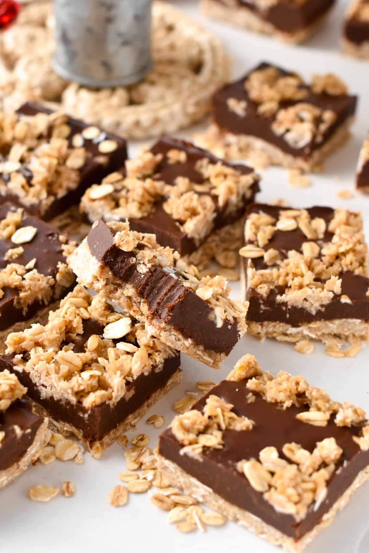 No-Bake Chocolate Peanut Butter Oatmeal Bars sprinkled with oats.