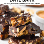 pieces of date bark made with Medjool dates, peanuts, peanut butter and melted dark chocolate