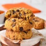 Pumpkin Protein Cookies stacked on coasters.