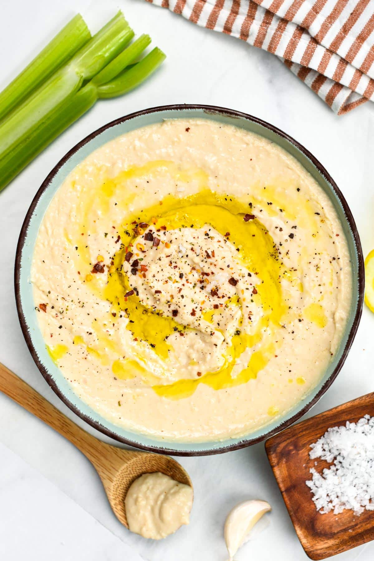 Vegan White Bean Dip in a bowl, decorated with olive oil.