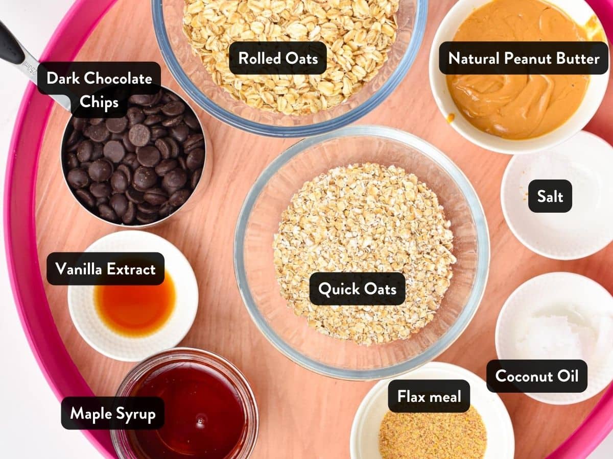 Ingredients for the No-Bake Peanut Butter Oat Cups in various bowls and ramekins on a large tray, with labels,