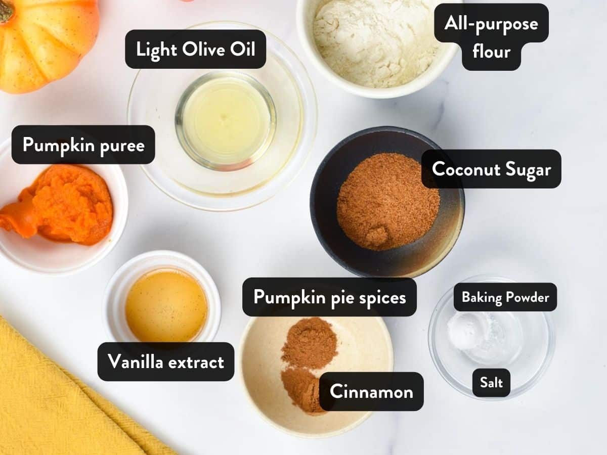 Ingredients for the Vegan Pumpkin Mug Cake in small containers, ramekins, and bowls with labels.