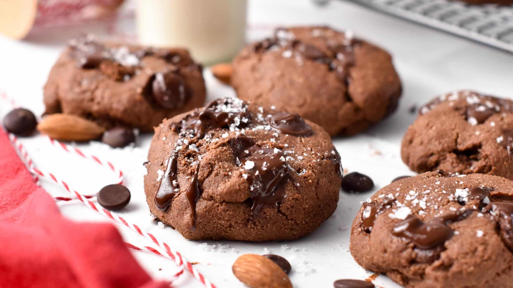 a chocolate almond flour cookie with chocolate chips and a pinch of salt on top