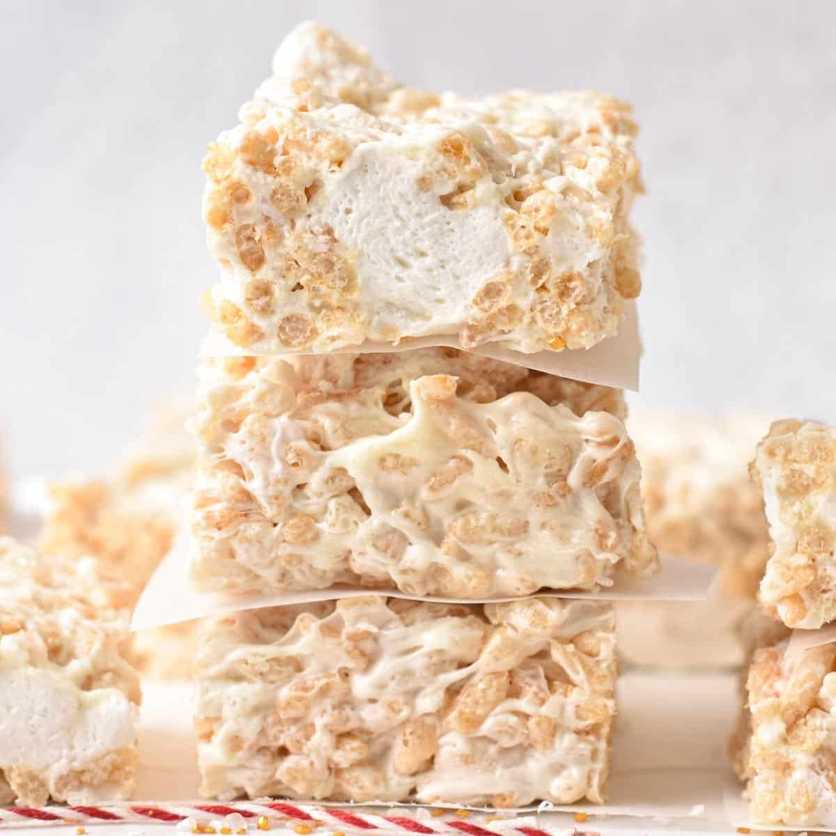 a stack of 3 vegan rice crispy treats filled with marshmallow