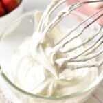 a stand mixer whisk with dairy-free whipped cream stiff peak