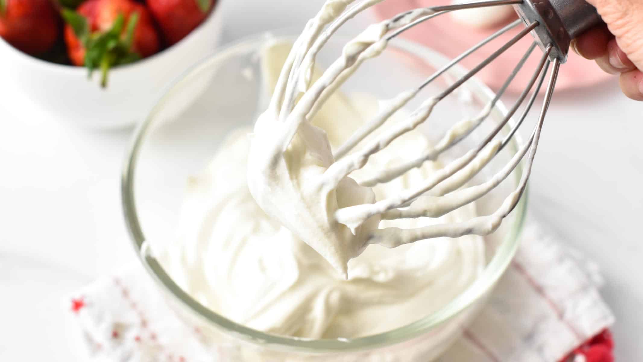 a stand mixer whisk with dairy-free whipped cream stiff peak