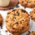 a stack of three Vegan Chocolate Chip Peanut Butter Cookies with crisscross shape on top