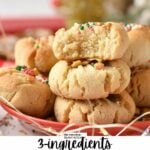 a stack of three almond flour shortbread cookies with the one on top half bitten