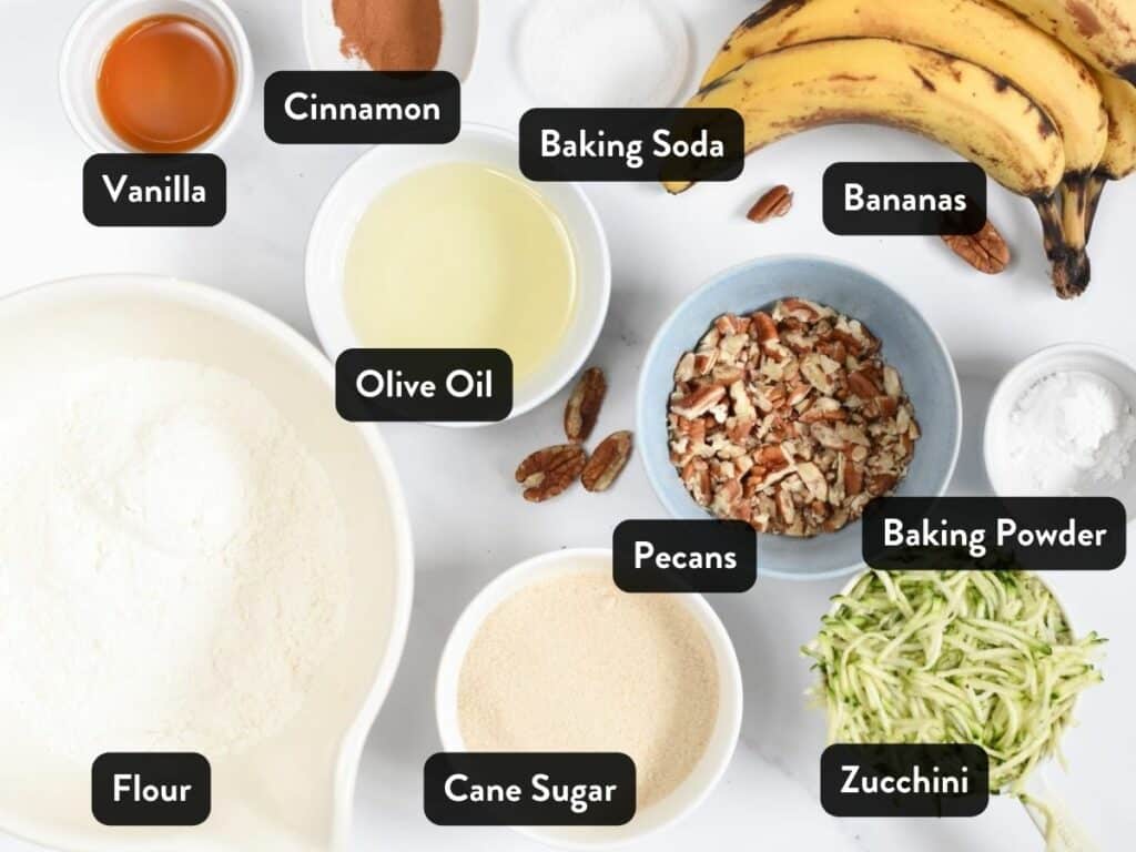 Ingredients for Healthy Zucchini Banana Bread in bowls and ramekins.