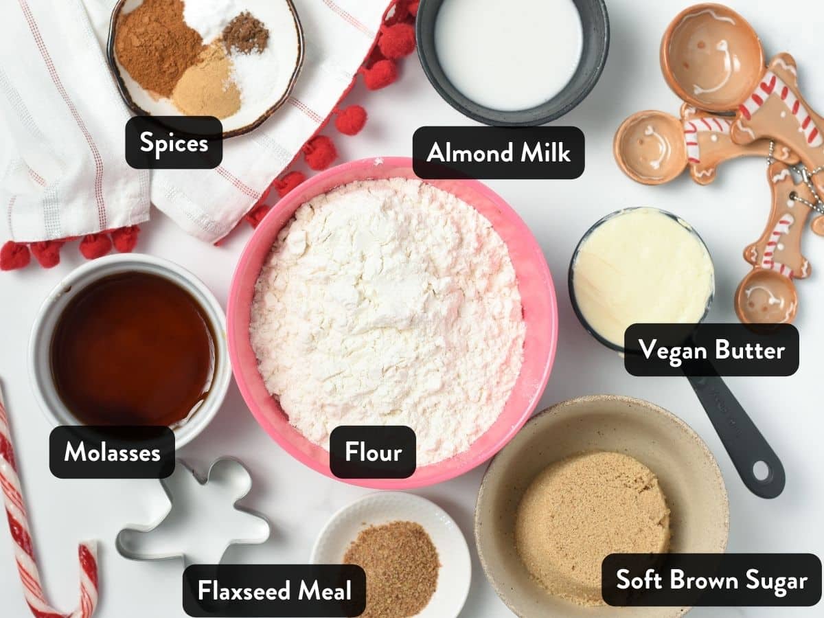 Ingredients for Vegan Gingerbread Cookies in bowls, ramekins, and measuring cups.