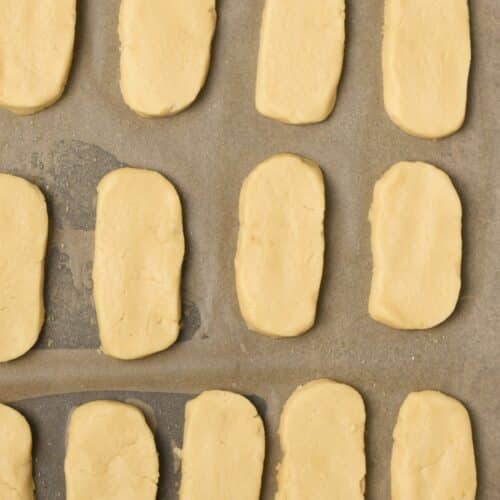 Formed Vegan Shortbread Cookies on a cookie sheet.