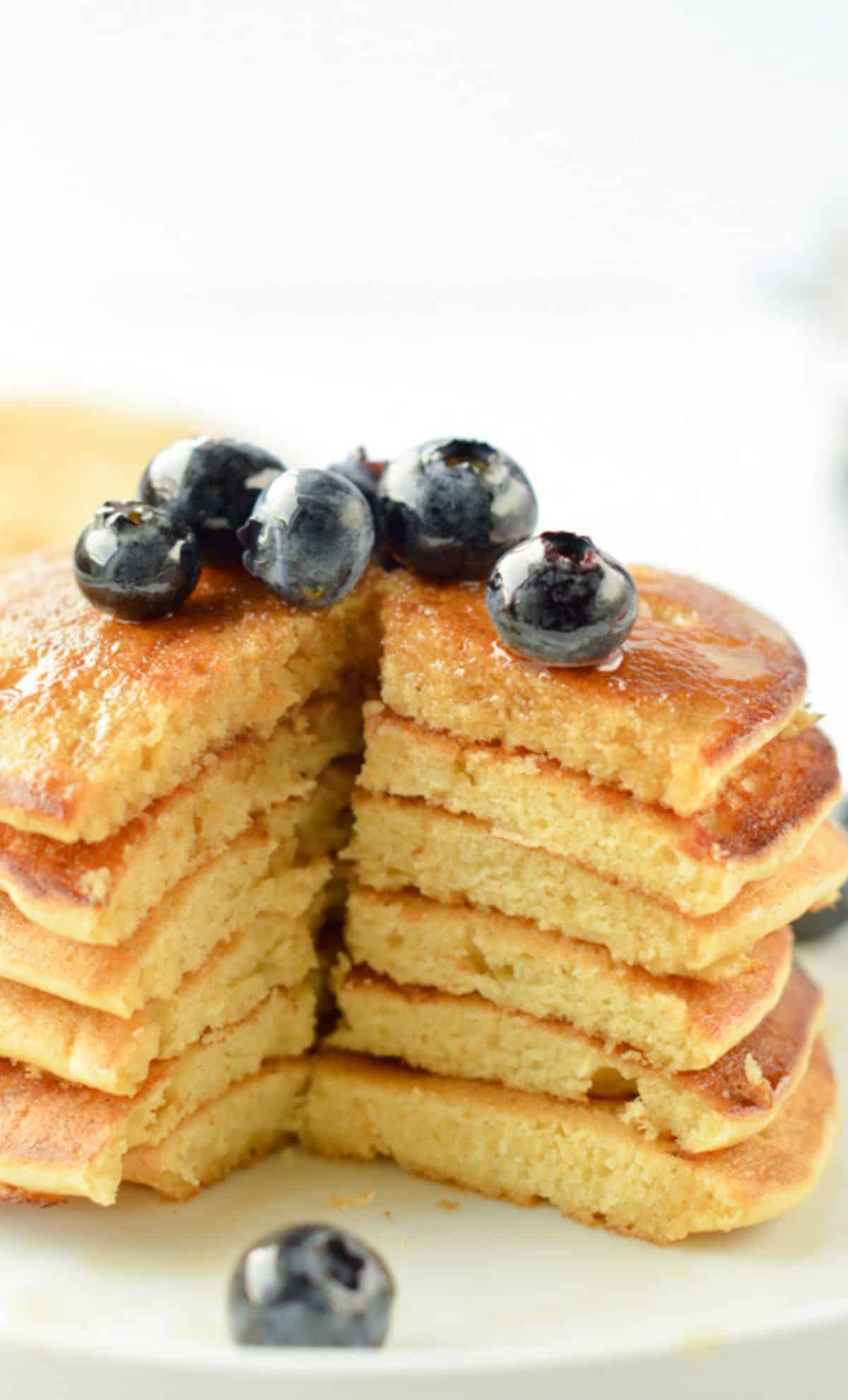 Stack of chickpea pancakes decorated with blueberries.