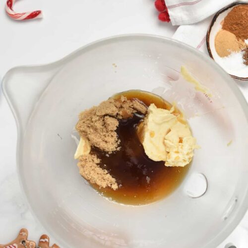 Stand mixer bowl with unmixed Vegan Gingerbread Cookie liquid ingredients.