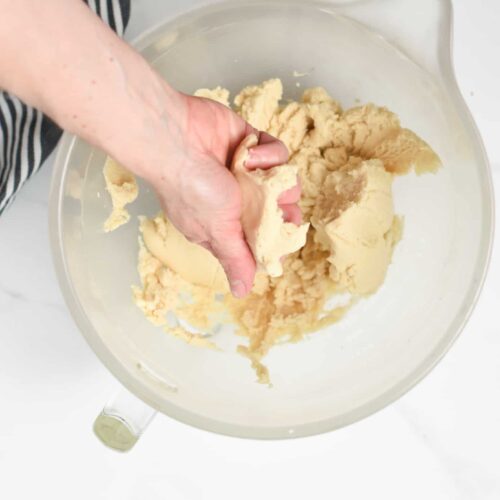 vegan shortbread cookie dough in a mixing bowl.