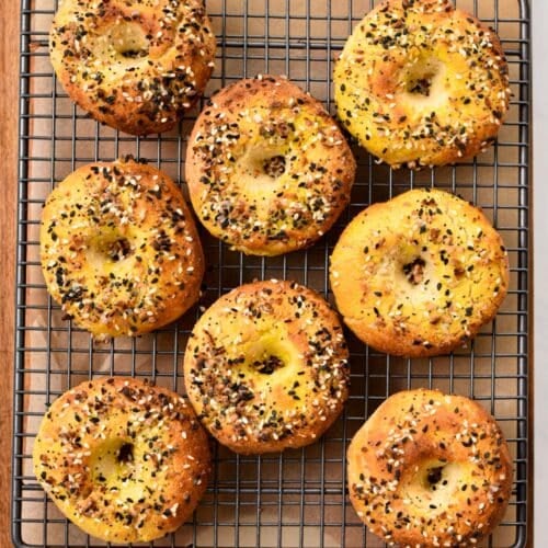 Almond flour bagels cooling down on a cooling rack.