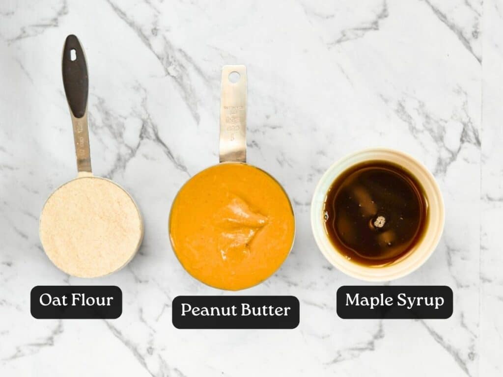 Ingredients for 3-Ingredient Peanut Butter Cookies in measuring cups and ramekins.
