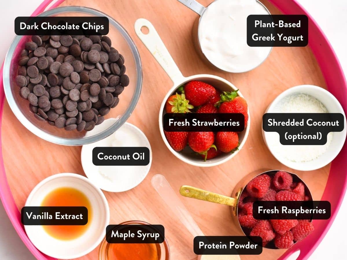 Ingredients for Yogurt Clusters in bowls and ramekins on a serving tray.