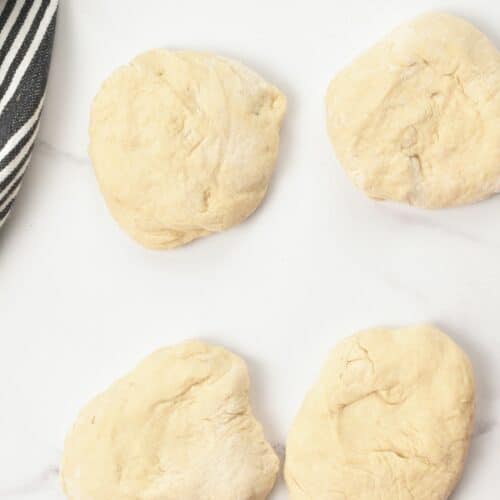 2-Ingredient Flatbread dough split into bowls.