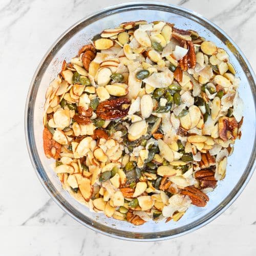 Combining Grain-Free Granola Ingredients in a bowl.