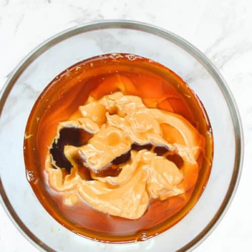 Bowl with peanut butter and maple syrup.